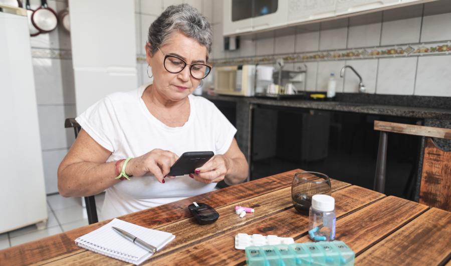 Older woman checking her blood sugar levels