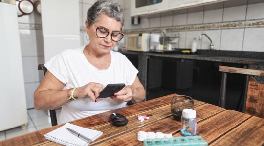 Older woman checking her blood sugar levels