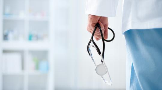 doctor holding stethoscope